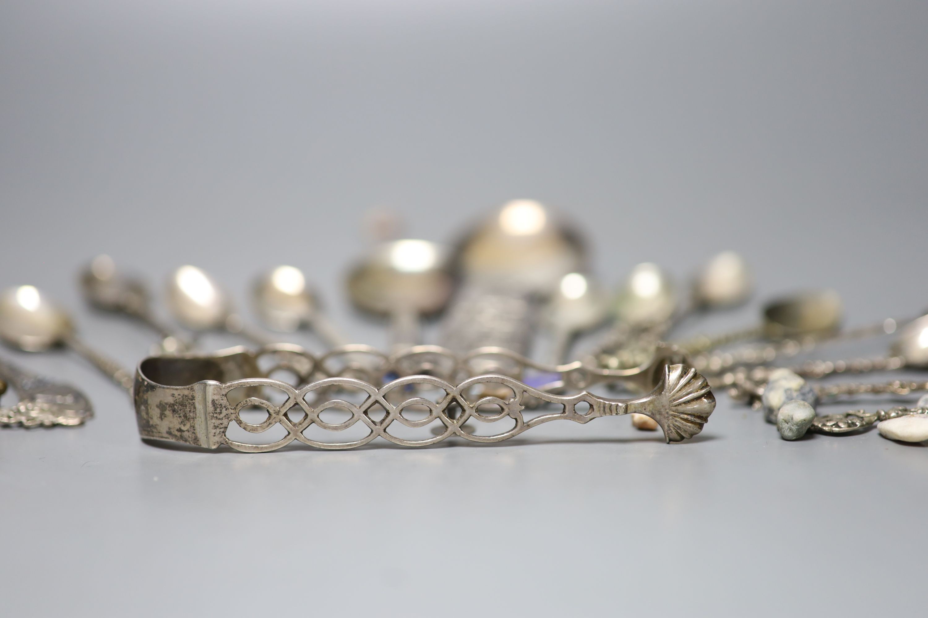 A Georg Jensen & Wendel A/S sterling small spoon, 10.2cm, a pair of antique silver sugar tongs(a.f.), a metal snuff box and a small group of minor spoons including continental white metal.